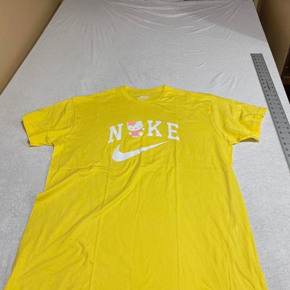 Nike Women’s Yellow Graphic Logo Tee